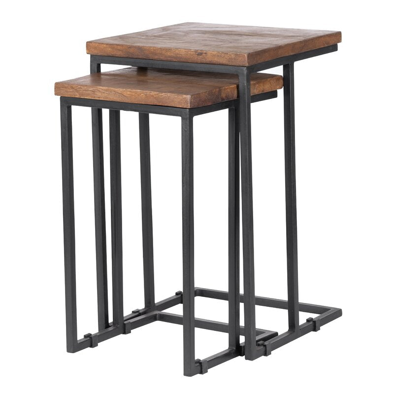 Nesting tables set with wood tops and metal frames, next to a sofa